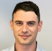 headshot Joshua Melunsky